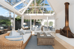 Vaucluse holiday home, lounge skylight fireplace, rattan sofa